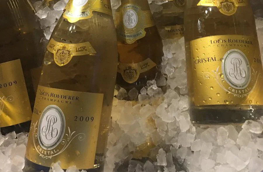 Louis Roederer Cristal 2009 champagne bottles on ice with gold labels