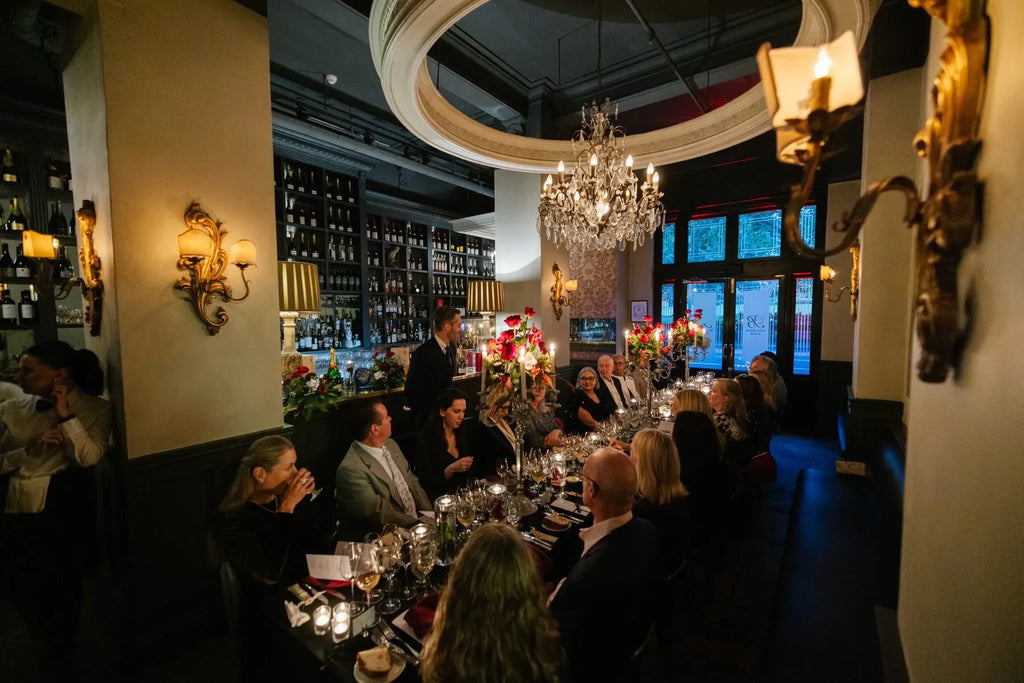 Elegant champagne dinner at a Sydney event featuring Bollinger paired with caviar. Dining experience, wine.