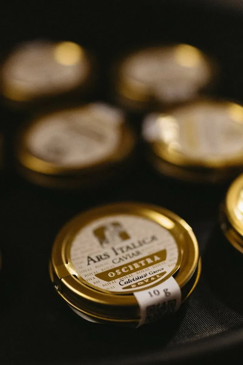 Ars Italica caviar Oscietra gold tin jars on dark background