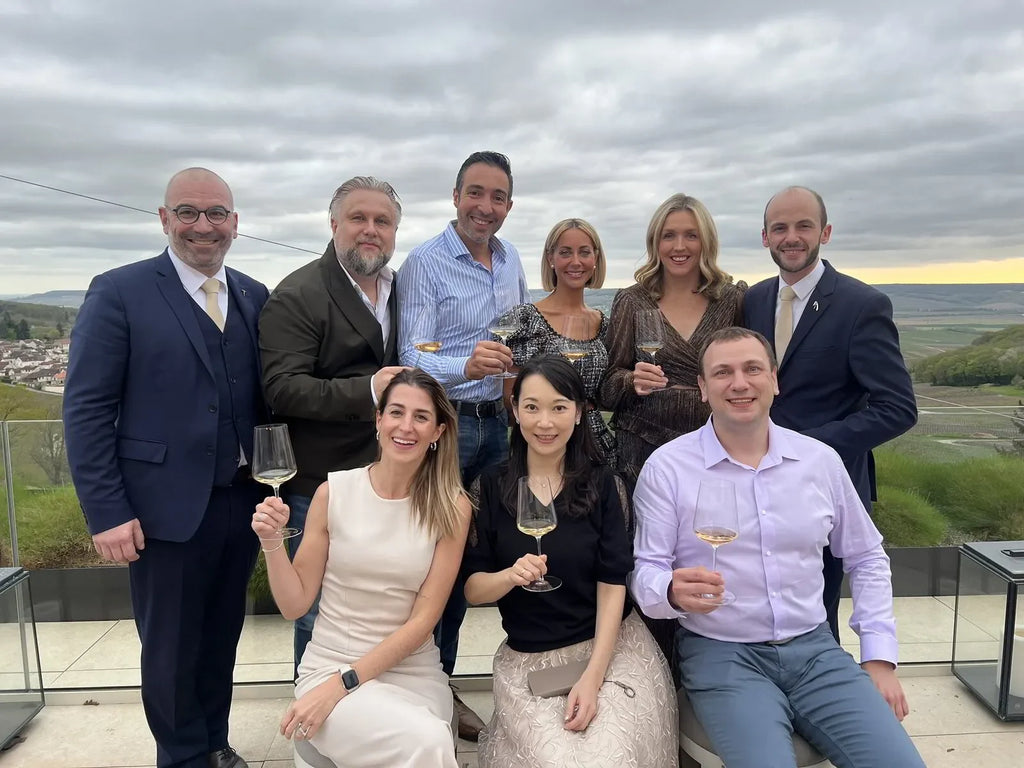 Le Printemps des Champagnes event in France: Group of people tasting champagne at a vineyard in April 2024.