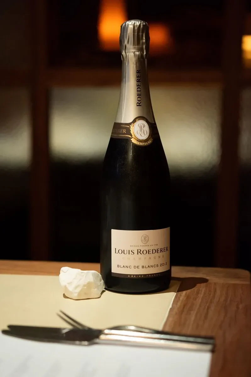 Louis Roederer Blanc de Blancs 2013 champagne bottle on a restaurant table