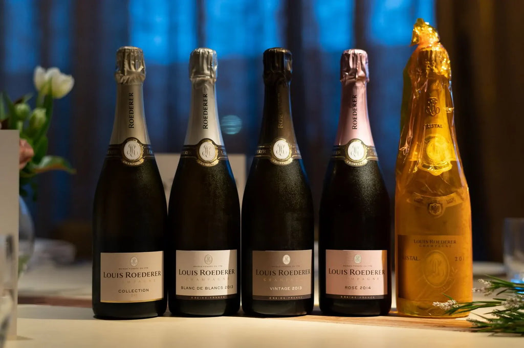 Louis Roederer champagne bottles lineup on a table, including Cristal and Rosé varieties