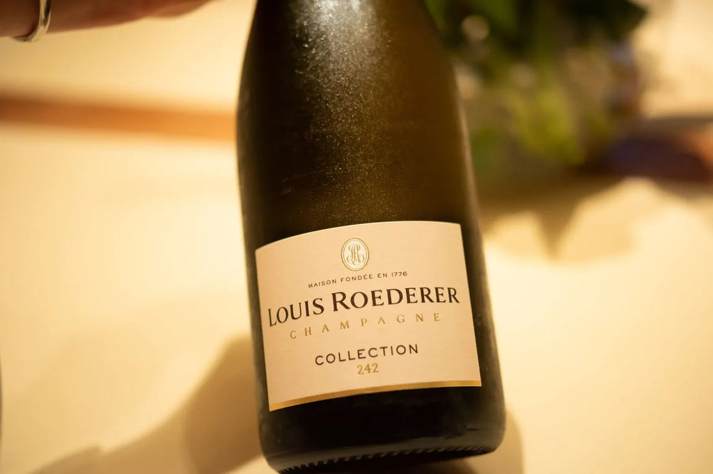 Louis Roederer Collection 242 Champagne bottle on a light table